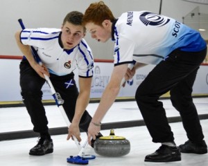 Angus Dowell and Duncan Menzies sweeping it onto the spot